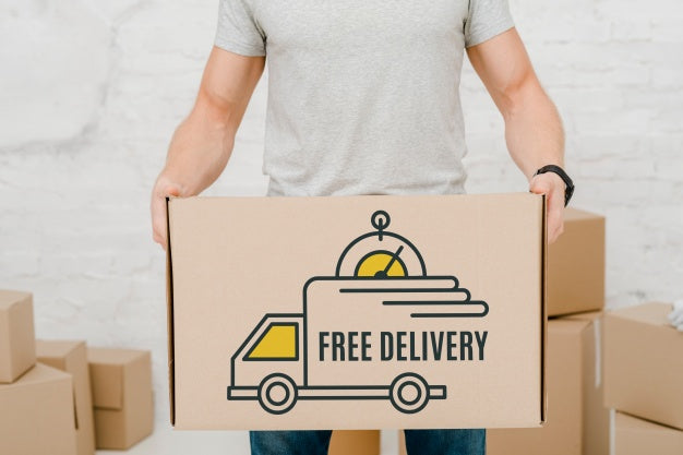 Mockup Of Man With Cardboard Boxes Psd