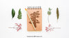Mockup Of Notepad And Leaves Psd