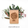 Mockup Of Notepad On Leaves Psd