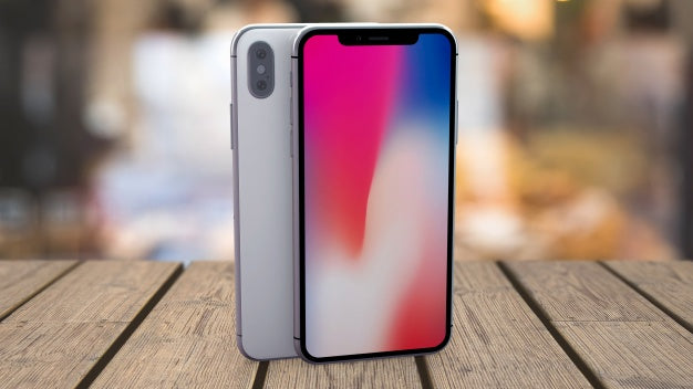 Mockup Of Smartphones On Tabletop Psd