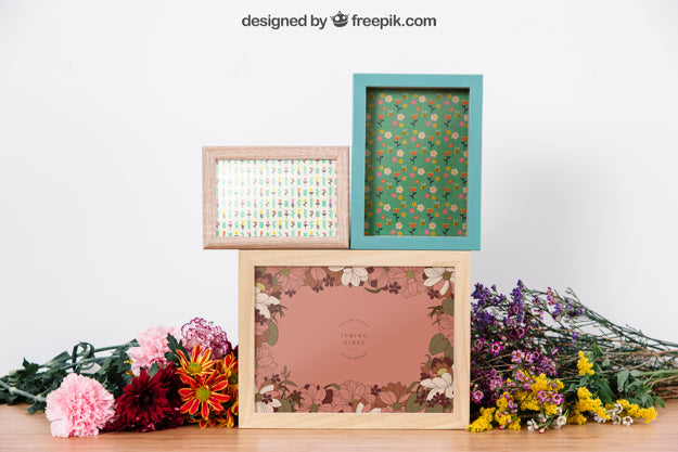 Mockup Of Three Frames Between Flowers Psd