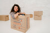 Mockup Of Woman With Cardboard Boxes Psd