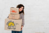 Mockup Of Woman With Cardboard Boxes Psd