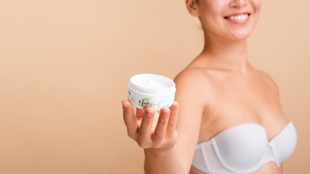 Model Holding A Skin Lotion Mock-Up Psd