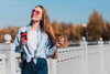 Modern Blonde Girl Holding A Cup Of Coffee Mock-Up Psd