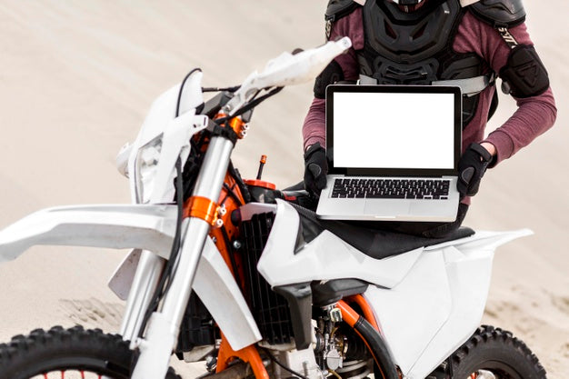 Motorcyclist Holding Laptop Psd