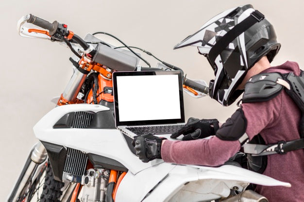 Motorcyclist Holding Laptop Psd