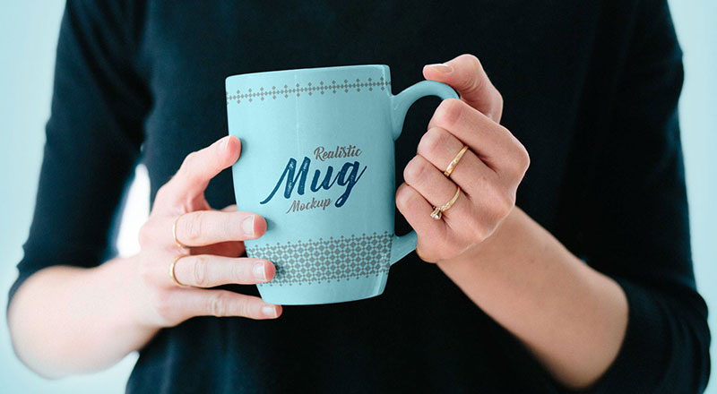 Mug In Female Hand Mockup Psd
