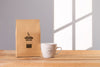 Mug With Coffee Bag Beside Psd