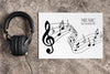 Music Design On Sheet With Headphones Beside Psd