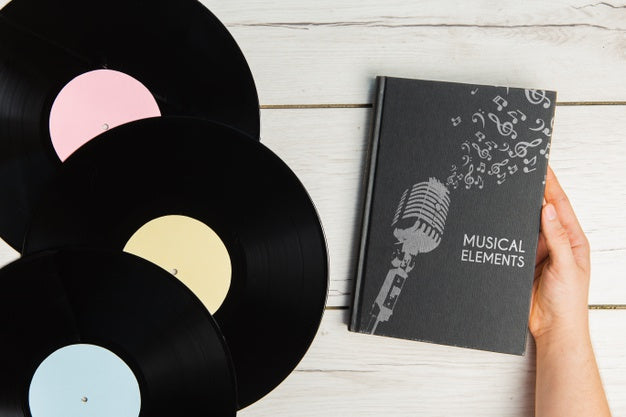 Music Elements Book With Vinyl Records Top View Psd