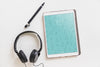 Music Mockup With Headphones Next To Tablet Psd