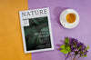 Nature Magazine Next To Coffee Cup And Lavender Psd