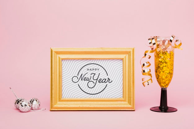 New Year Lettering With Golden Confetti In Glass Psd