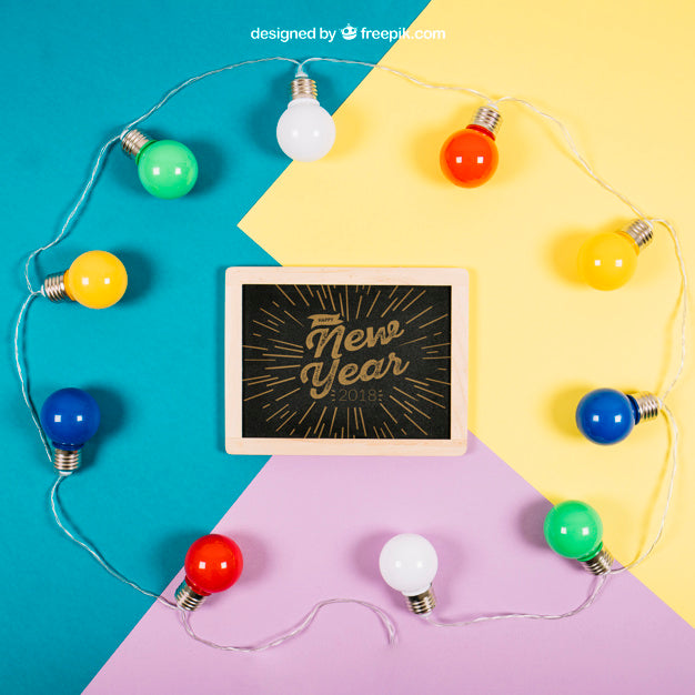 New Year Mockup With Slate And Bulbs Psd