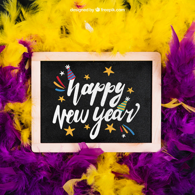 New Year Mockup With Slate And Purple And Yellow Feather Psd