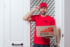 Non-Stop Delivery Standing Next To A Door Psd