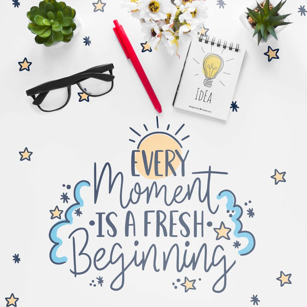 Notebook Little Plants And Motivational Message On White Table Psd