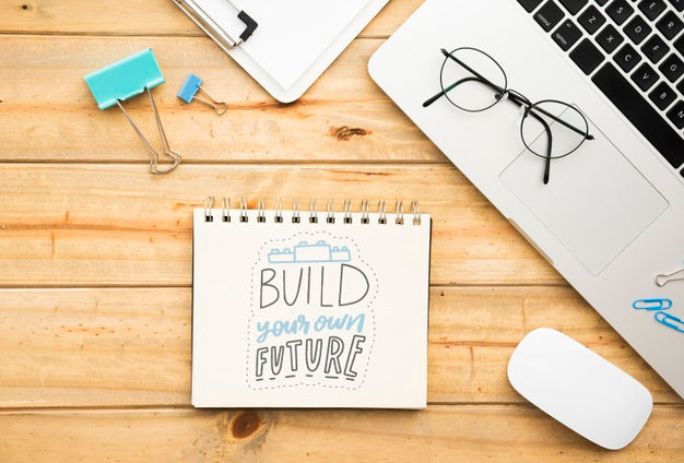 Notebook On Desk With Positive Message Psd