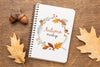 Notebook With Acorns And Leaves Beside Psd