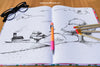 Notebook With Drawing Of Landscape, Pencils And Glasses Psd