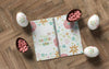 Notebook With Easter Eggs On Table Psd