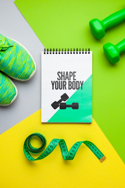 Notebook With Fitness Shoes And Weights Psd