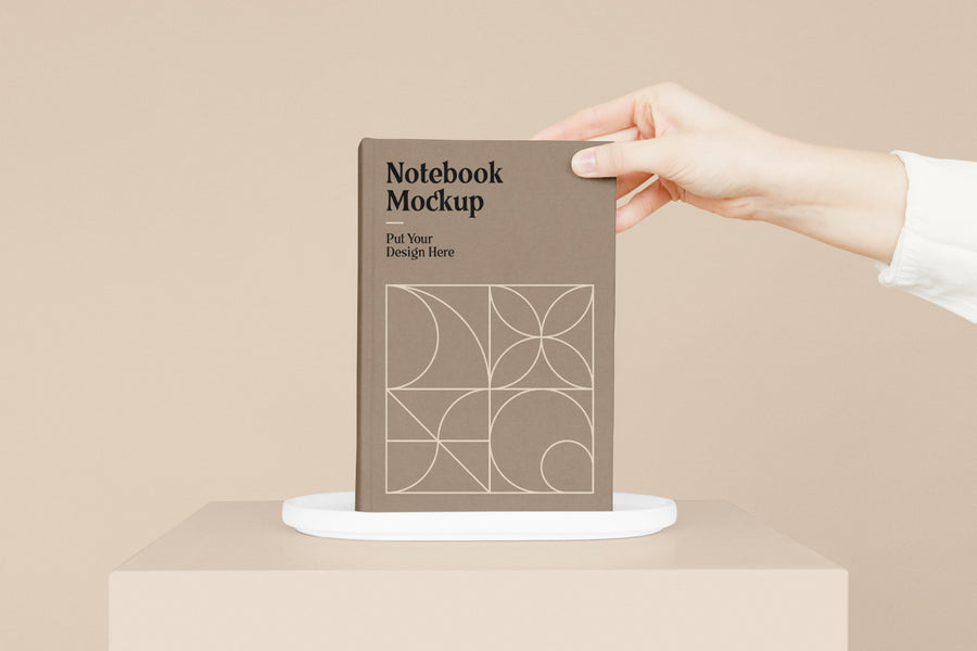 Notebook With Hand Mockup