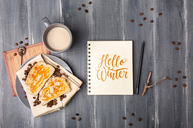 Notebook With Hello Winter Message Beside Breakfast Psd