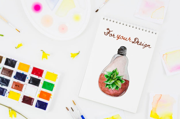 Notebook With Realistic Draw And Acrylic Pallette Beside Psd