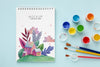 Notebook With Watercolors And Brushes Psd