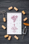 Notebook With Wine Stoppers On Table Psd