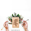 Notepad Mockup With Hands And Leaves Psd