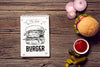 Notepad With Burger Sketch On Wooden Background Psd