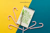 Notepad With Pencil And Candy Canes Psd