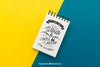 Notepad With Quote On Yellow And Blue Background Psd