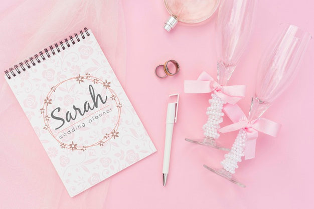 Notepad With Wedding Ideas And Champagne Glasses Psd