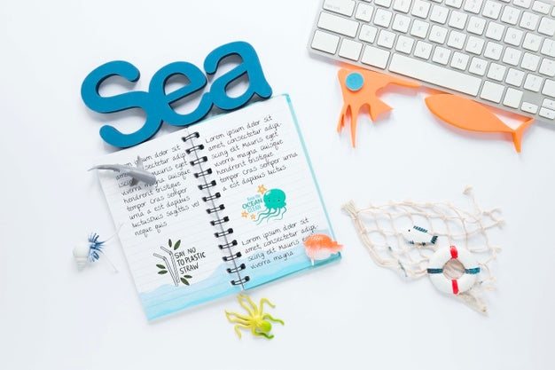 Ocean Day Notebook And Keyboard Concept Psd