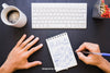 Office Desk And Hands Drawing With Pen On The Notebook Psd