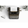 Old Typewriter On A Desktop With White Roses Psd
