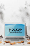 Opened Laptop Mockup On The Table Surrounded By Autumn Leaves Psd