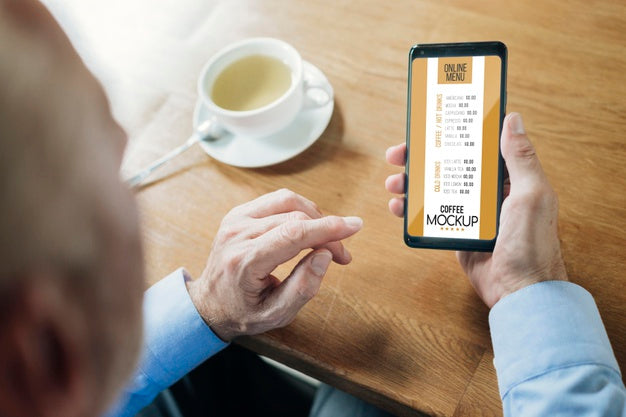 Over The Shoulder Adult In A Coffee Shop Mock-Up Psd