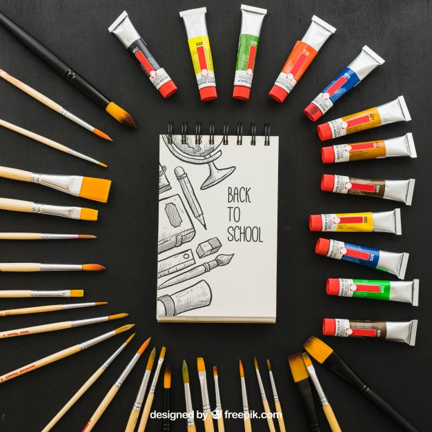 Paint And Brushes Around The Notebook Psd
