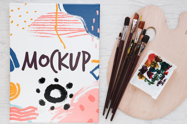 Painting Watercolors And Brushes On Table Psd