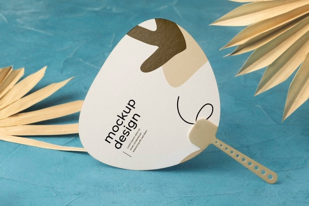 Paper Mock-Up Hand Fan With Dry Leaves Psd