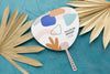 Paper Mock-Up Hand Fan With Dry Leaves Psd