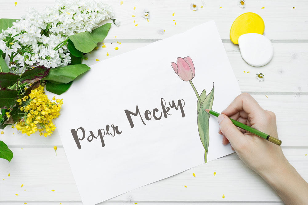 High Resolution White Sketch Paper Mockup with a Hand Drawing