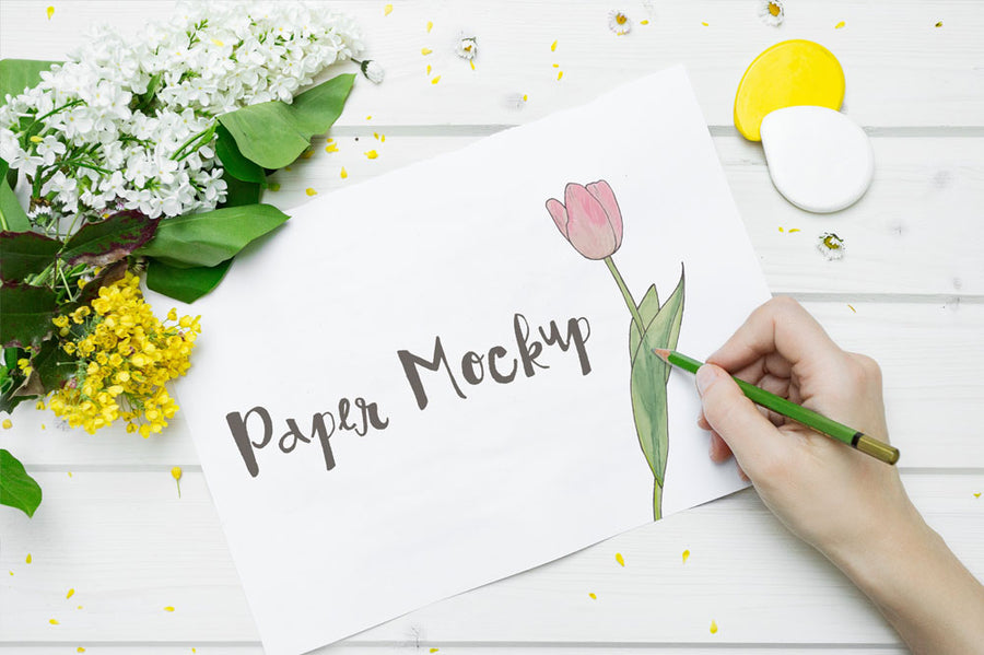 High Resolution White Sketch Paper Mockup with a Hand Drawing