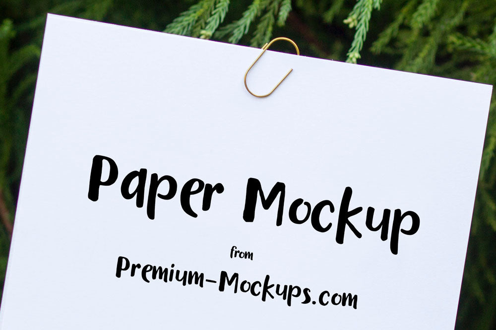 Empty White Paper in a Hand PSD Mockup