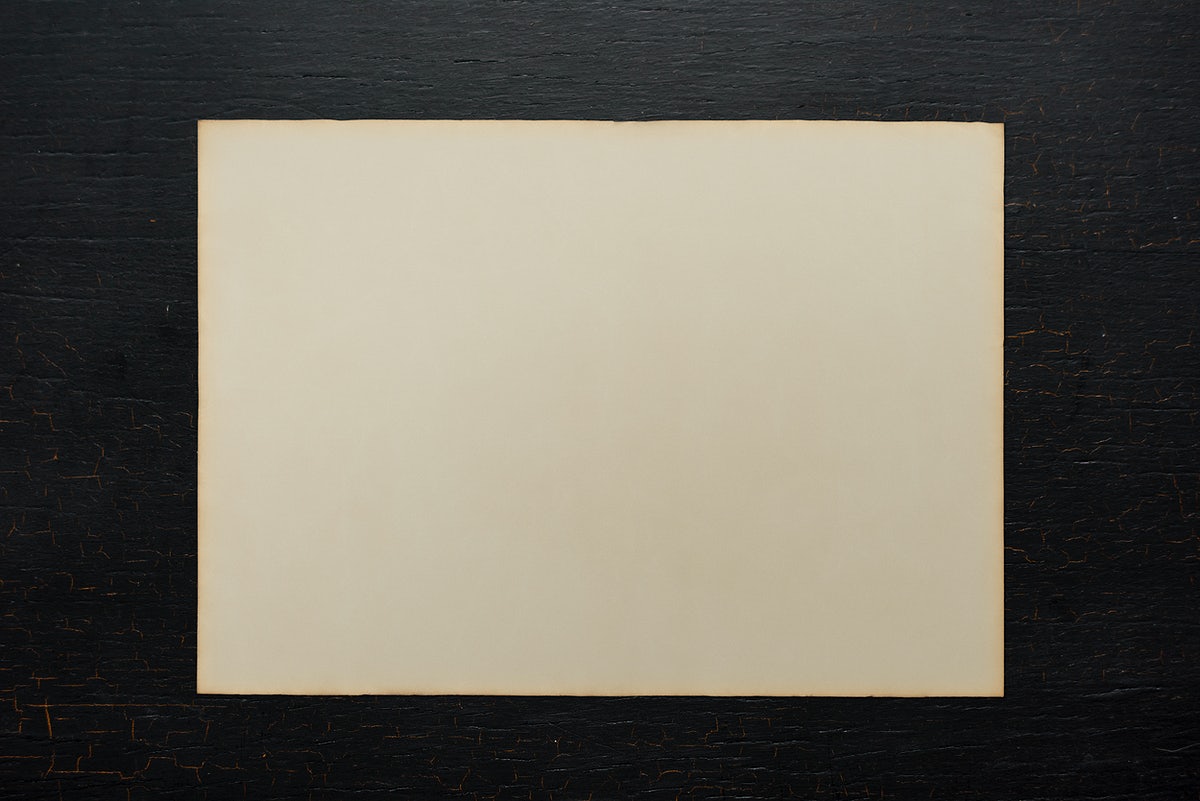 Paper On A Black Wooden Background